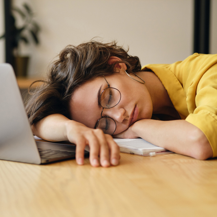 Woman asleep on desk